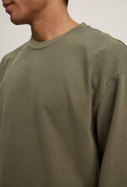 Person wearing Velvet tees mens Finnick Long Sleeve Crew cactus green