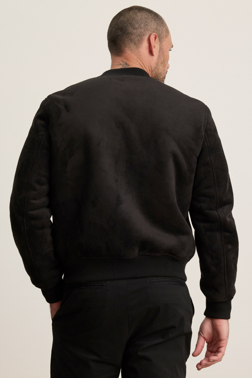 Person wearing Velvet tees mens suede Amias Sherpa Bomber Jacket