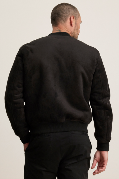 Person wearing Velvet tees mens suede Amias Sherpa Bomber Jacket