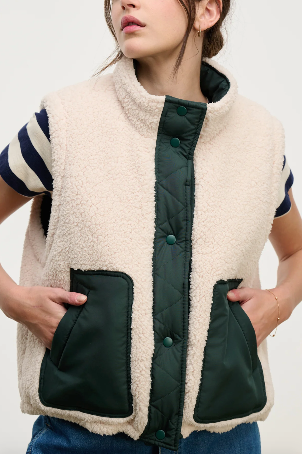 Person wearing Velvet tees womens Cathy Puffy Sherpa Reversible Vest Alpine Green