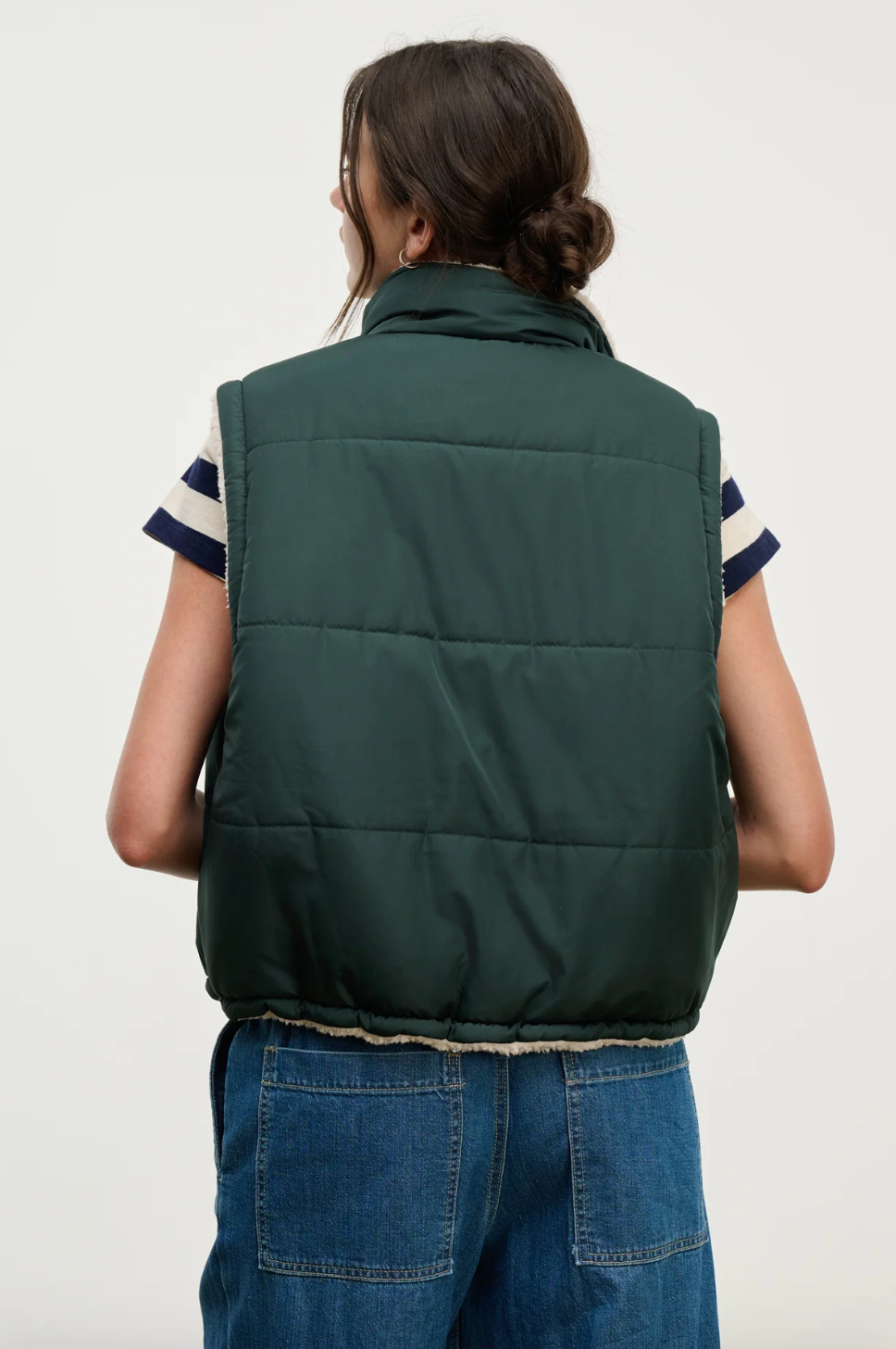 Person wearing Velvet tees womens Cathy Puffy Sherpa Reversible Vest Alpine Green
