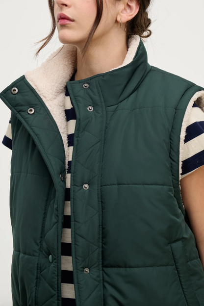 Person wearing Velvet tees womens Cathy Puffy Sherpa Reversible Vest Alpine Green