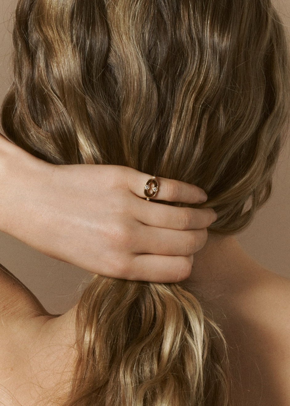 Person wearing Viltier fine jewelry 18k yellow gold diamond Magnetic Ring with Bulls Eye