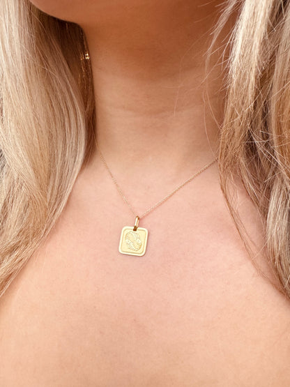 Person wearing Vintage fine jewelry 14k yellow gold Pisces Pendant