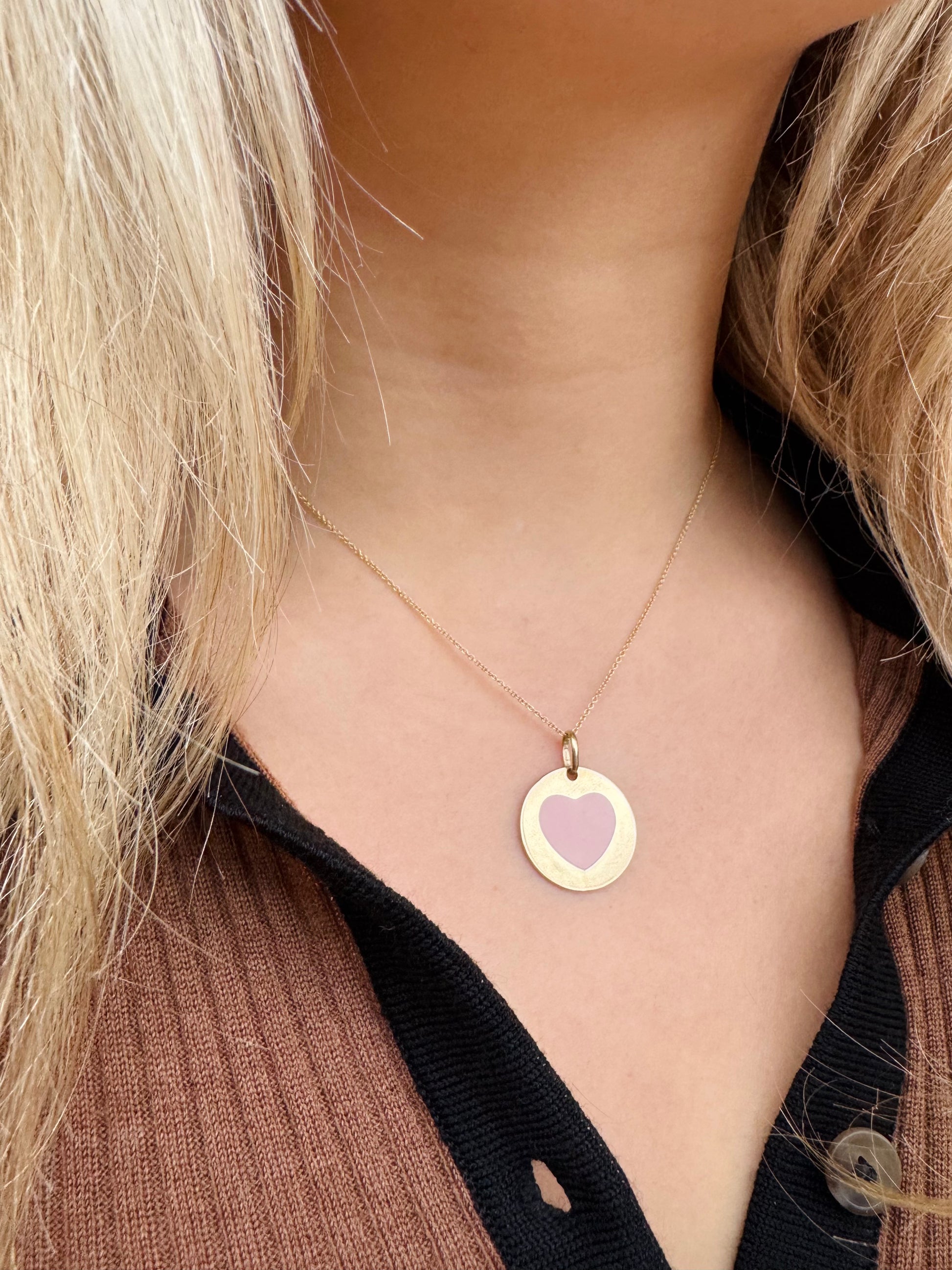 Person wearing Vintage fine jewelry 14k yellow gold pink Enamel Heart Disc Pendant