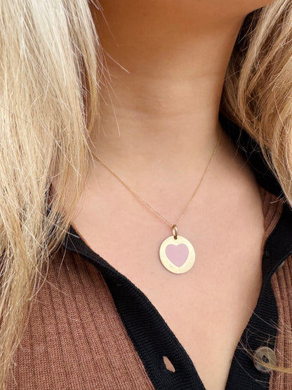 Person wearing Vintage fine jewelry 14k yellow gold pink Enamel Heart Disc Pendant