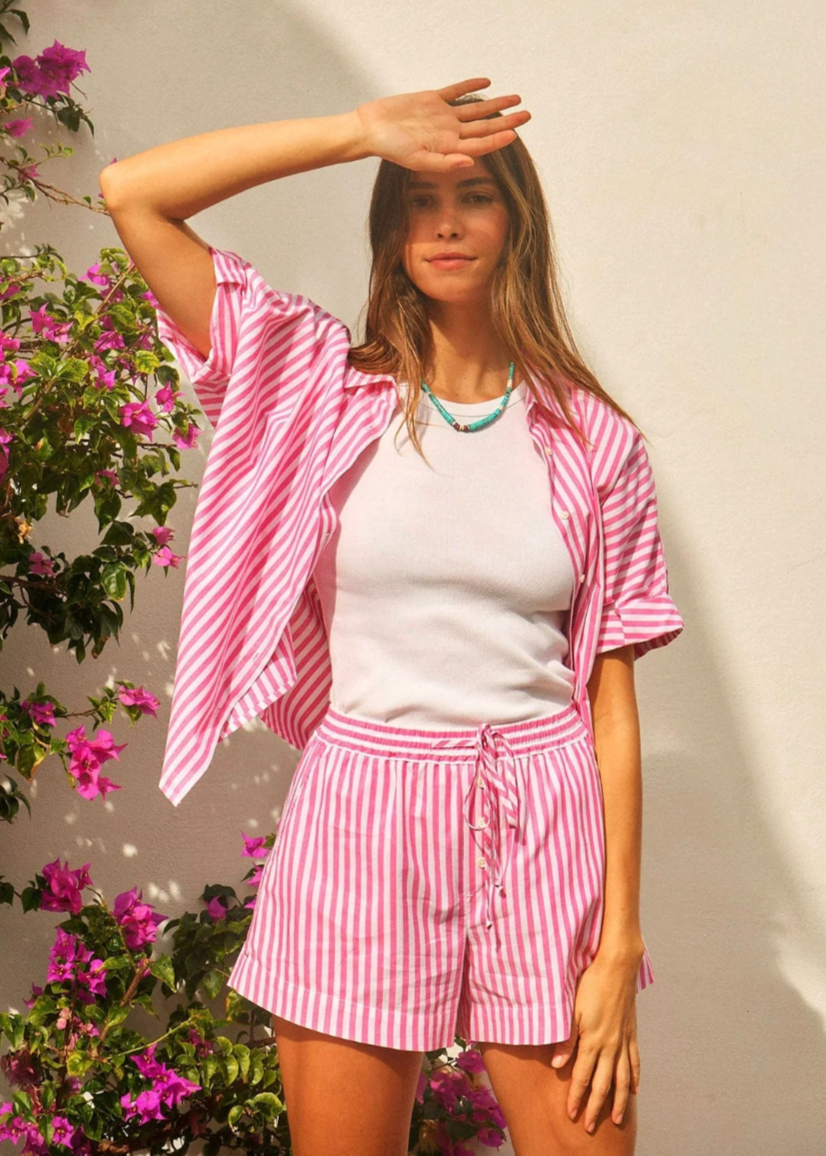 Person wearing Xirena Cotton Drawstring Tomer Short in Rosebud Stripe