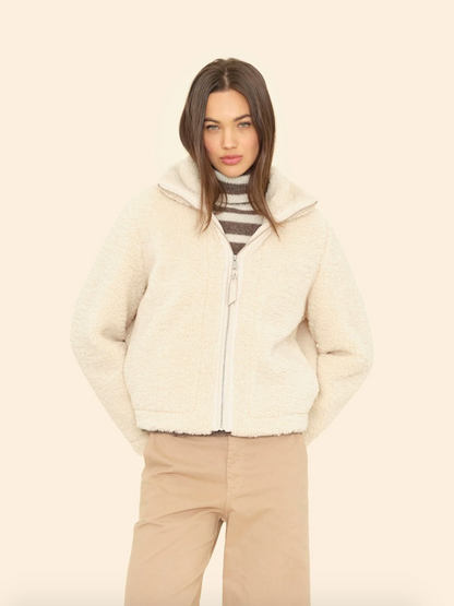 Person wearing Xirena Dree Bomber in Cream