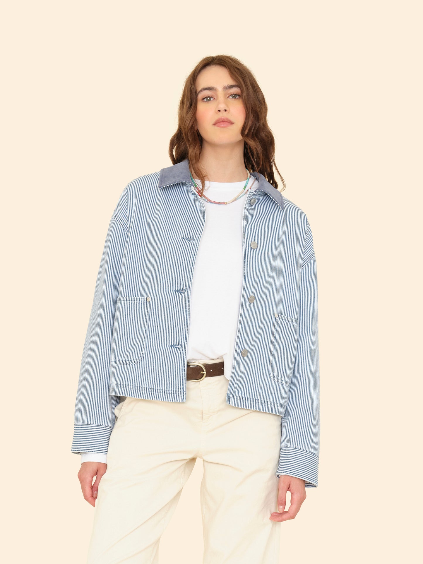 Person wearing Xirena womens Baldwin Jacket in Blue Railroad stripe