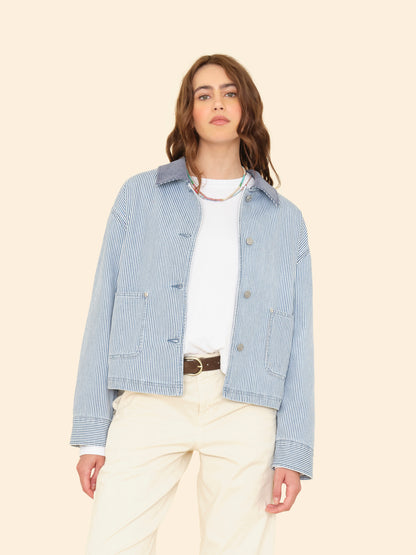 Person wearing Xirena womens Baldwin Jacket in Blue Railroad stripe