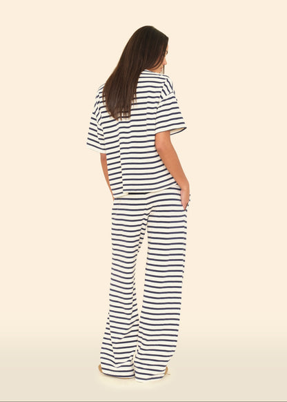 Person wearing Xirena womens Emmette Sweatpant in Natural Stripe