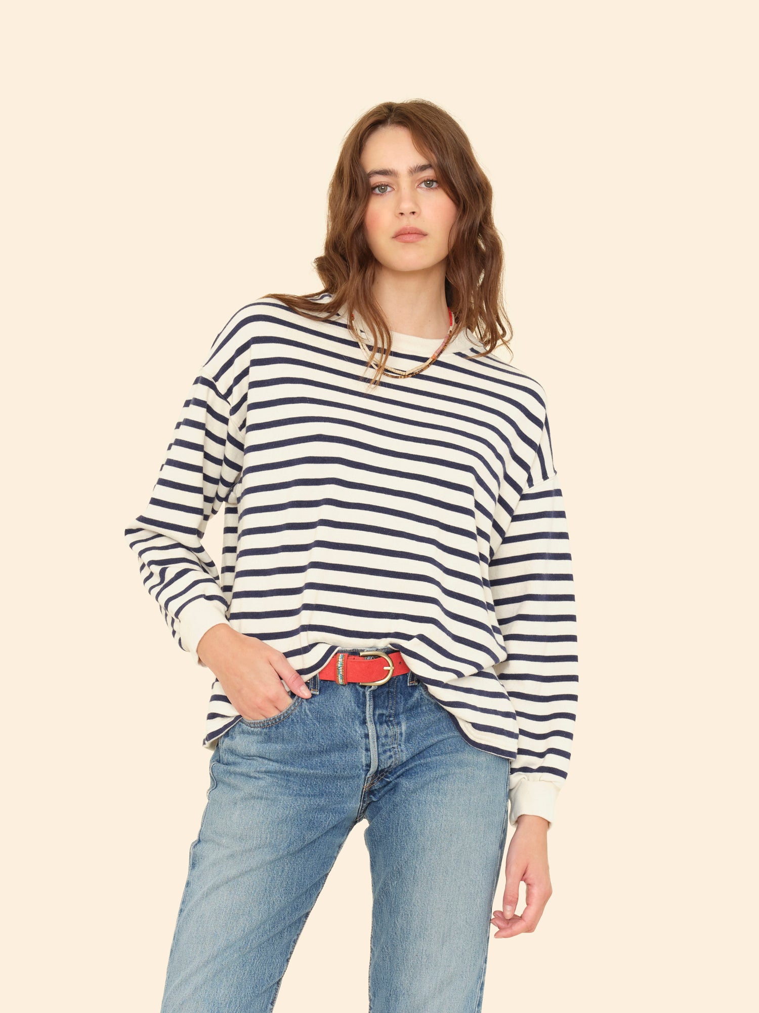 Person wearing Xirena womens Honor Sweatshirt in Natural Stripe