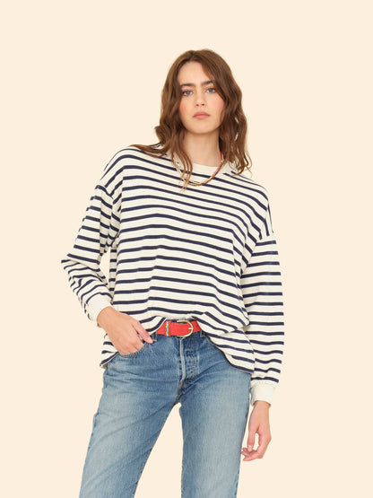 Person wearing Xirena womens Honor Sweatshirt in Natural Stripe