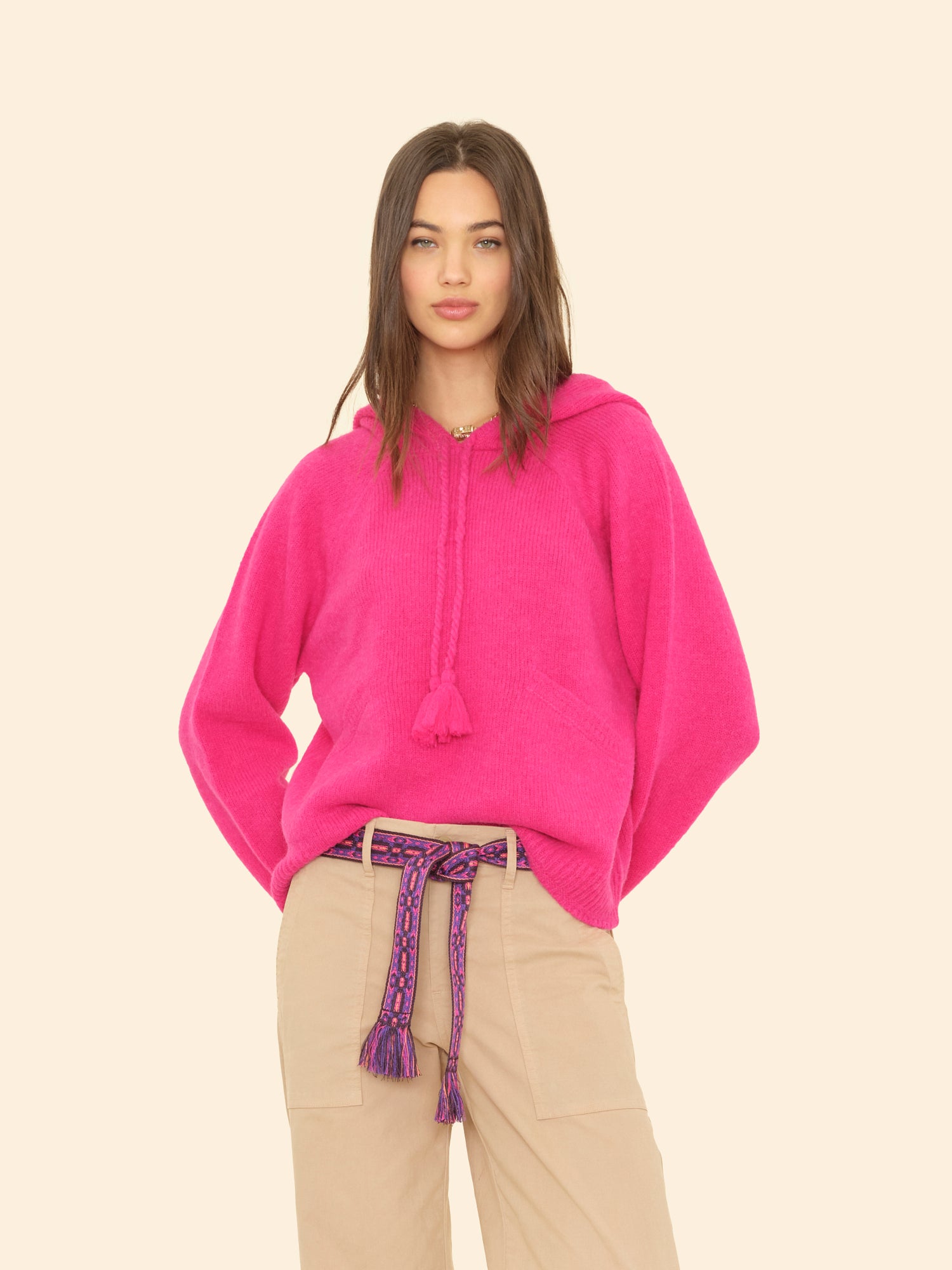 Person wearing Xirena womens Kayla Sweater in Brilliant Pink