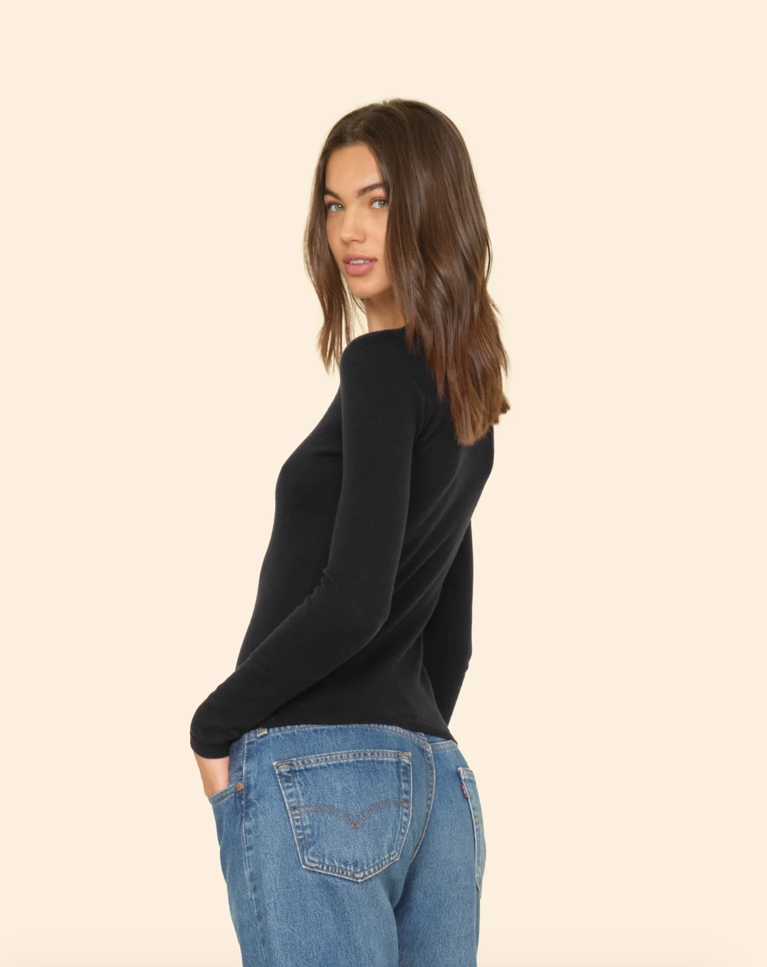 Person wearing Xirena womens cotton cashmere Crewe Sweater in Black
