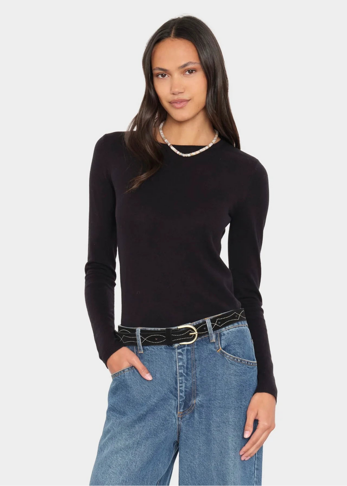 Person wearing Xirena womens cotton cashmere Crewe Sweater in Black