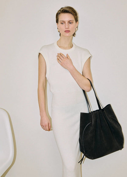 person wearing Scallop Tote in Ganache Suede