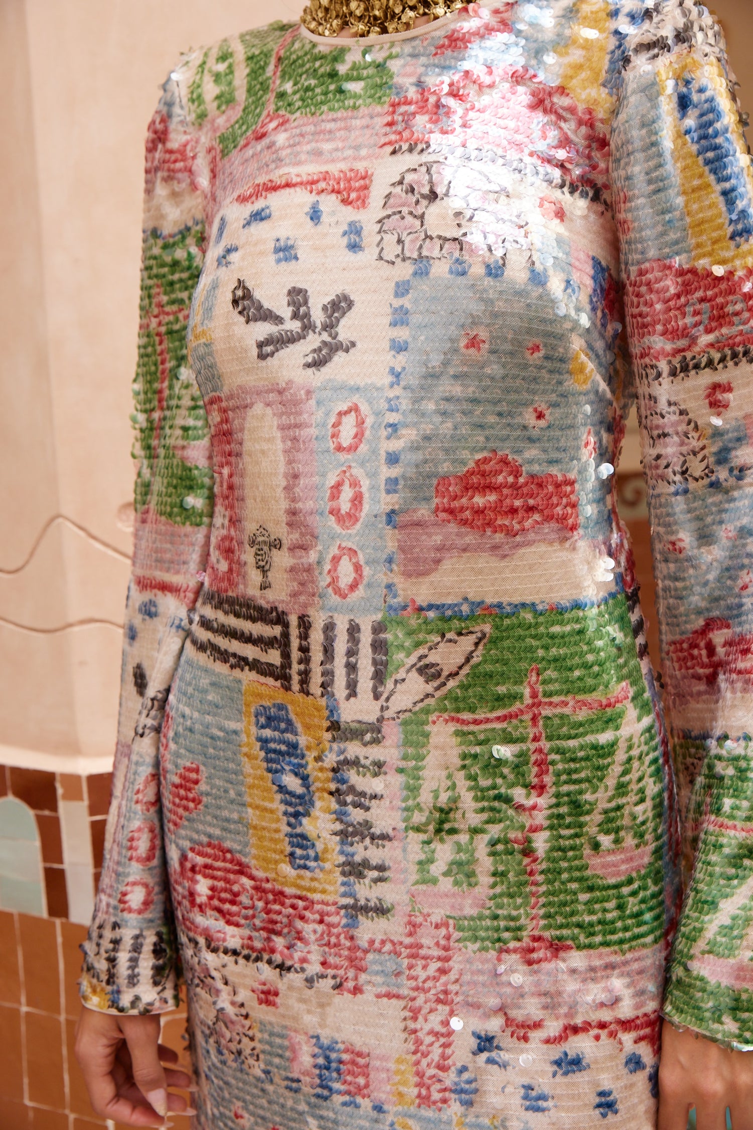 person wearing alemais womens Lumira printed Sequin Gown multicolor