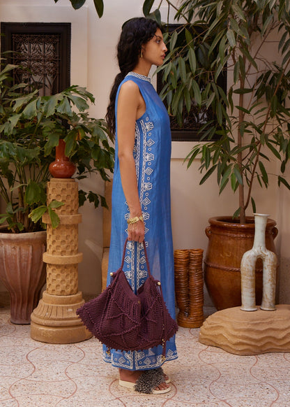 person wearing alemais womens Yasmeen Embellished Midi Dress blue white beaded