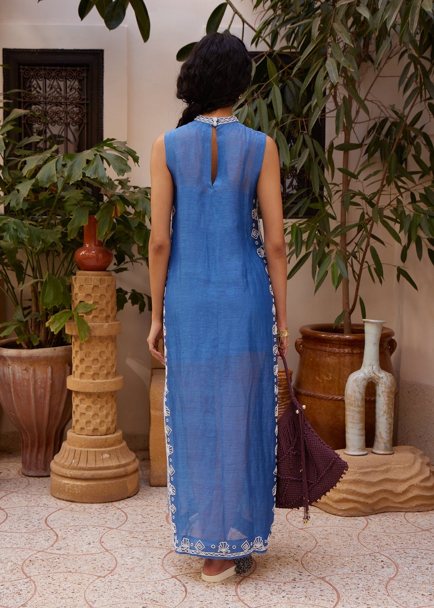 person wearing alemais womens Yasmeen Embellished Midi Dress blue white beaded