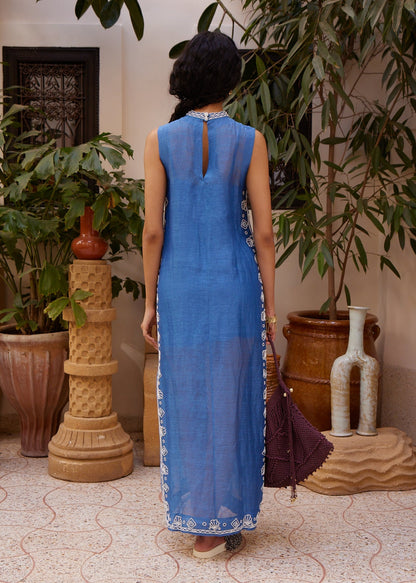 person wearing alemais womens Yasmeen Embellished Midi Dress blue white beaded