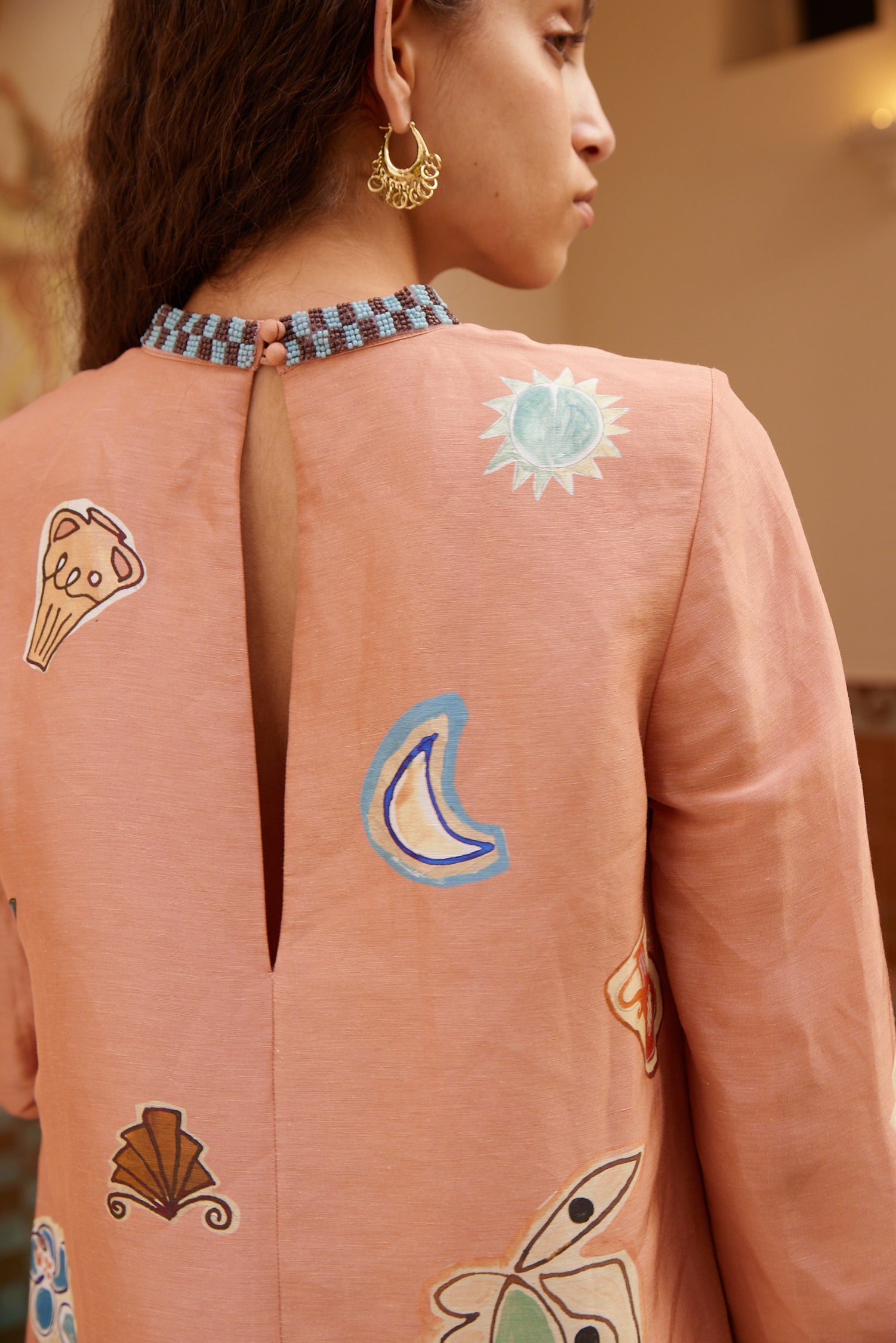 person wearing alemais womens pink printed Laurence Mini Dress