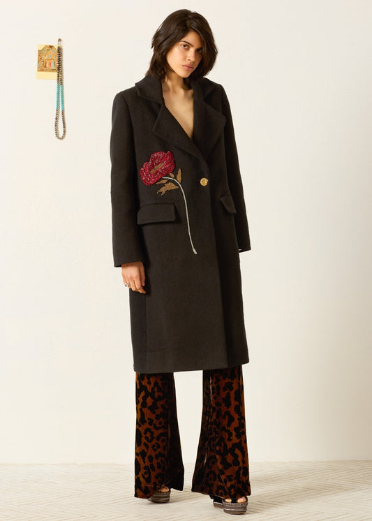 person wearing alix of bohemia beaded Petunia Sangria Poppy Coat