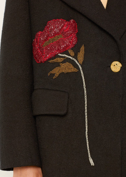 person wearing alix of bohemia beaded Petunia Sangria Poppy Coat