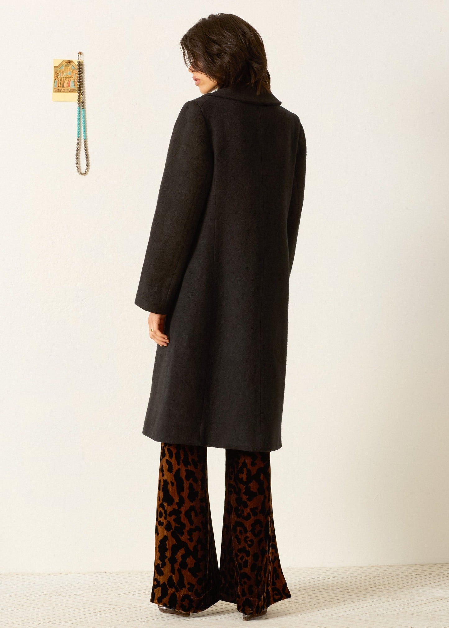 person wearing alix of bohemia beaded Petunia Sangria Poppy Coat