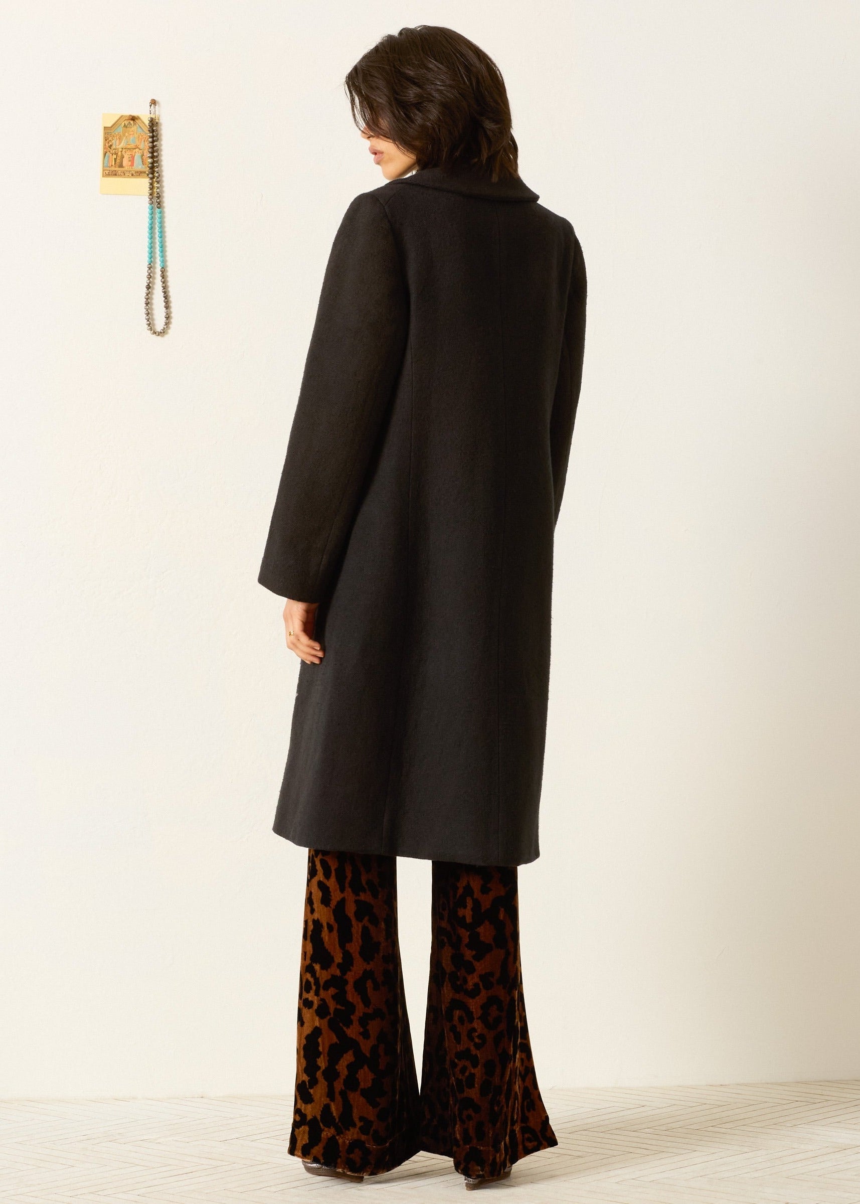 person wearing alix of bohemia beaded Petunia Sangria Poppy Coat