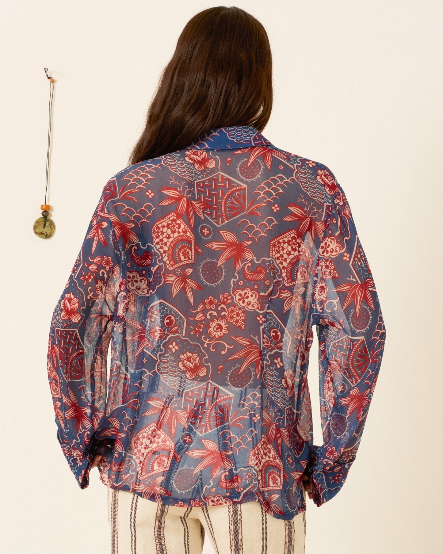 person wearing alix of bohemia printed blue Dana Delft Hive Shirt