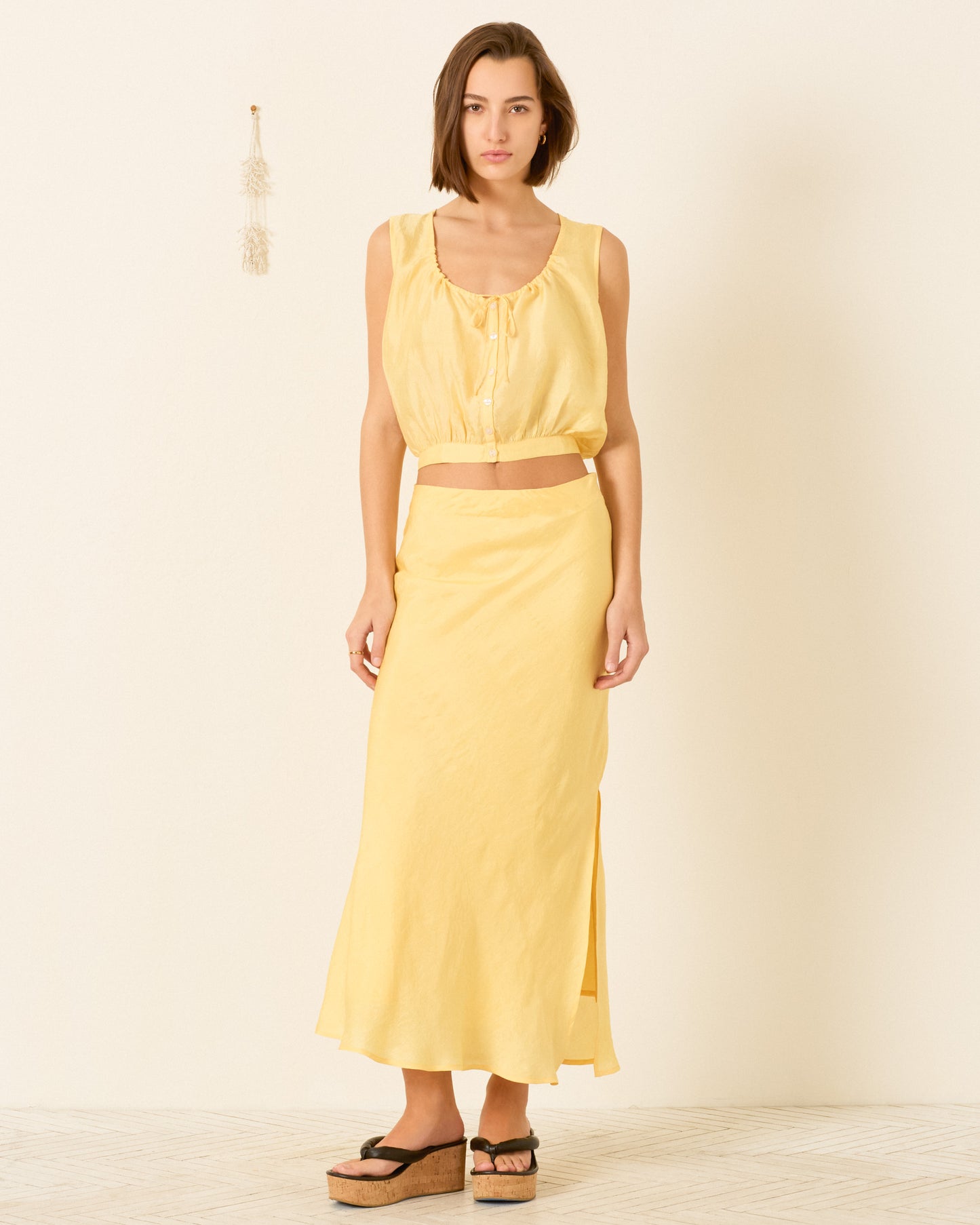 person wearing alix of bohemia womens Nova Sunlight Silk Shirt yellow Lyra Sunlight Silk Skirt
