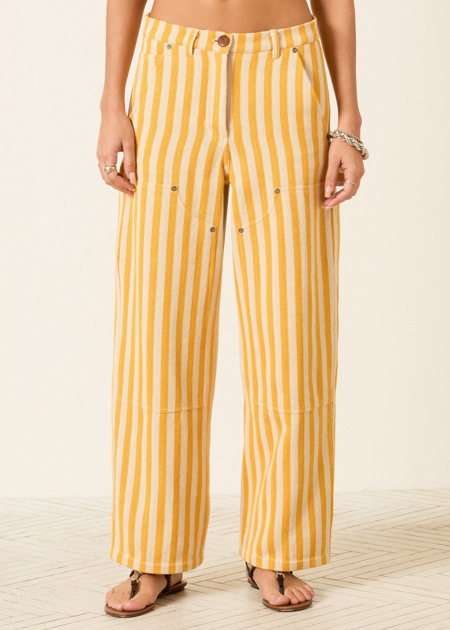person wearing alix of bohemia womens embroidered Scottie Sunlight yellow Stripe painter carpenter Pant