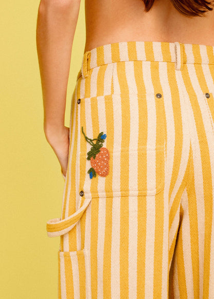 person wearing alix of bohemia womens embroidered Scottie Sunlight yellow Stripe painter carpenter Pant