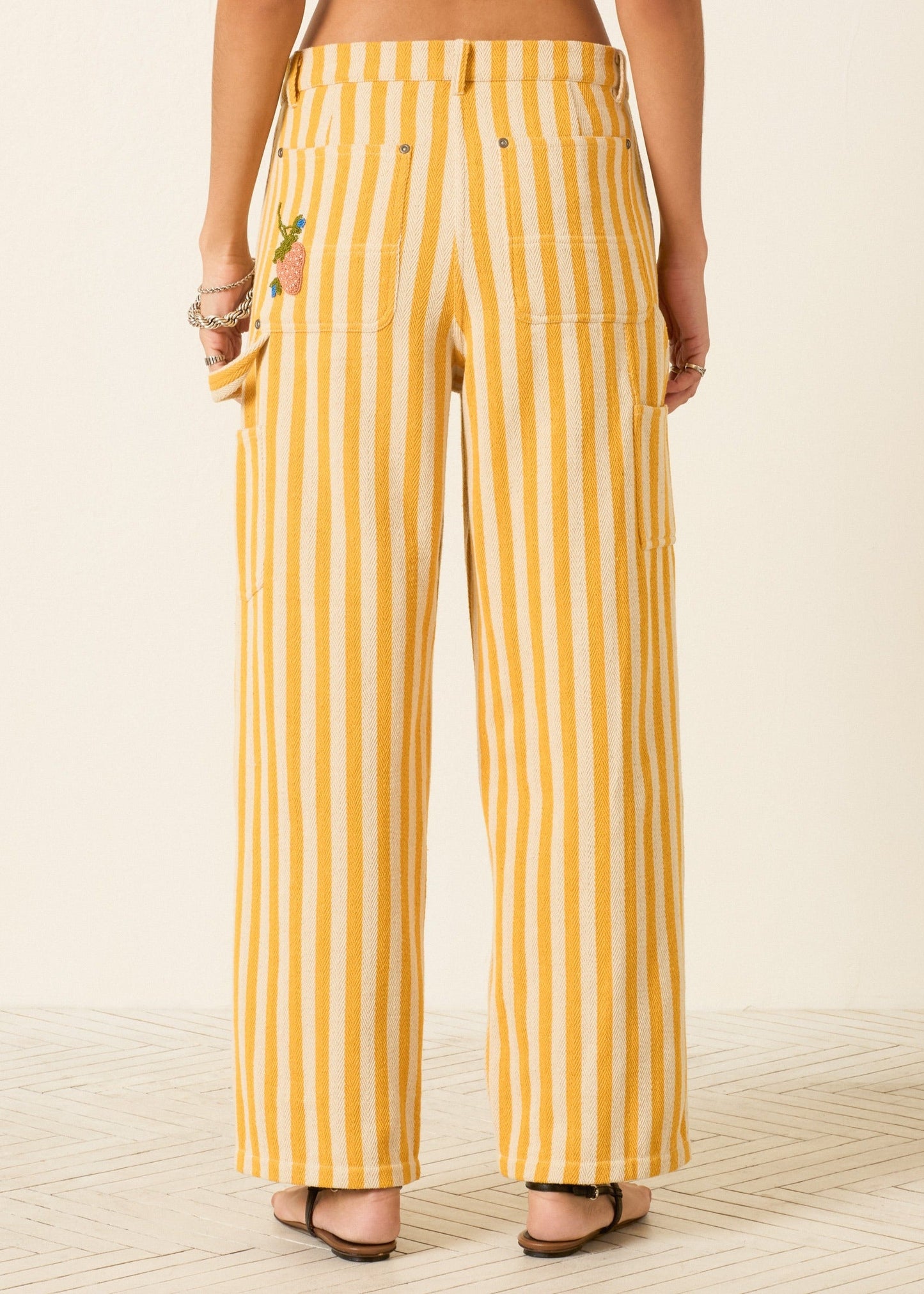 person wearing alix of bohemia womens embroidered Scottie Sunlight yellow Stripe painter carpenter Pant