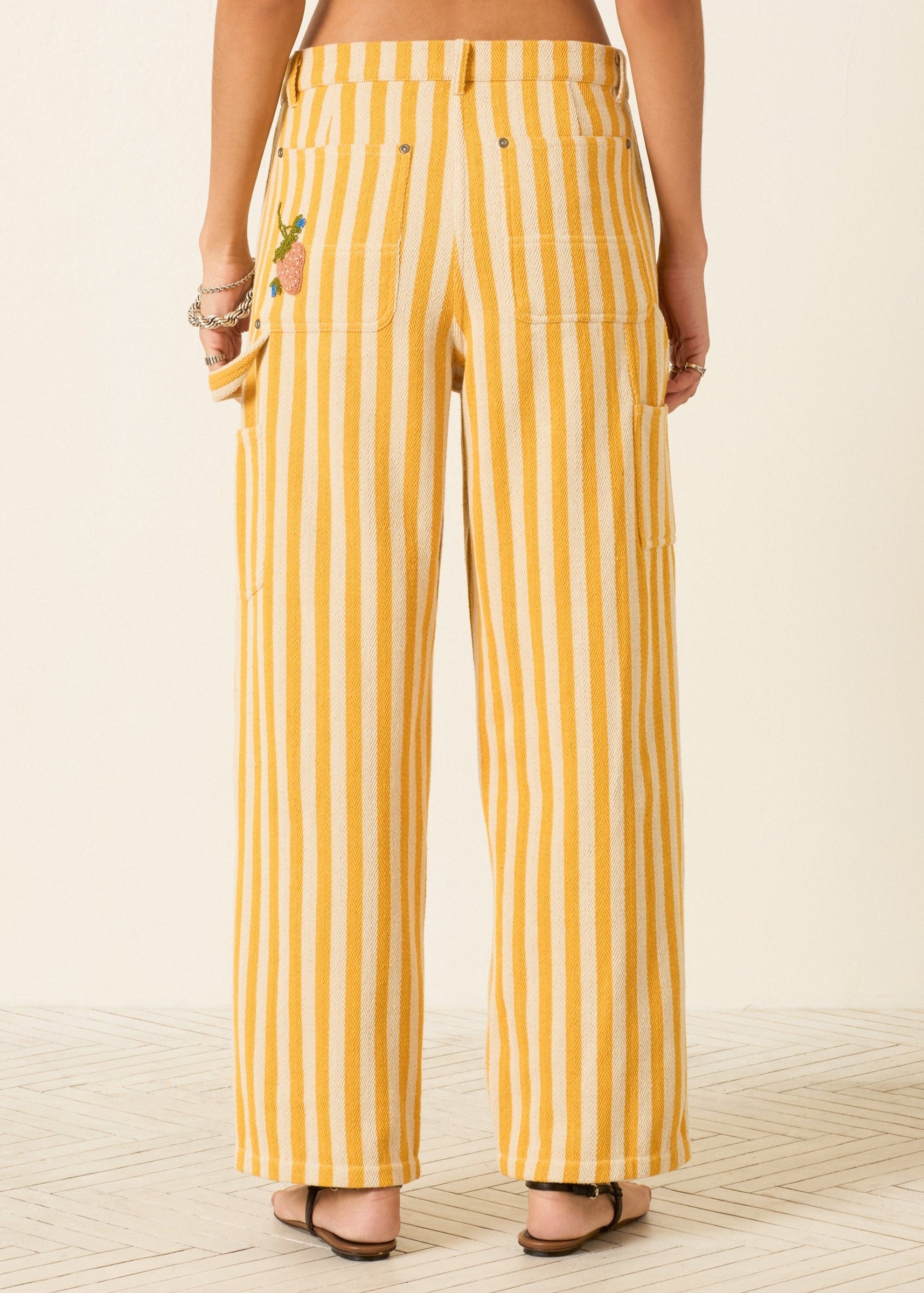 person wearing alix of bohemia womens embroidered Scottie Sunlight yellow Stripe painter carpenter Pant