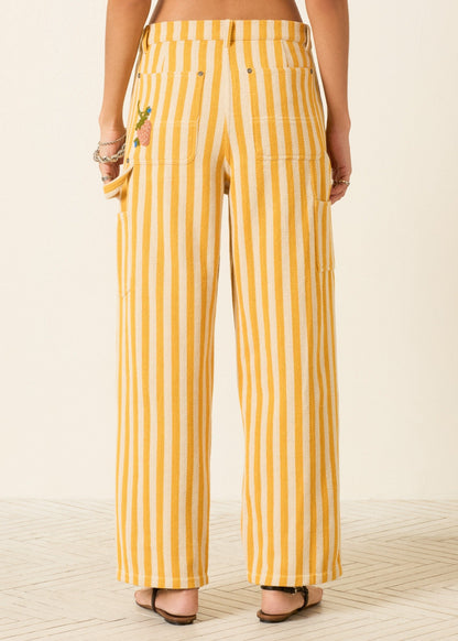 person wearing alix of bohemia womens embroidered Scottie Sunlight yellow Stripe painter carpenter Pant
