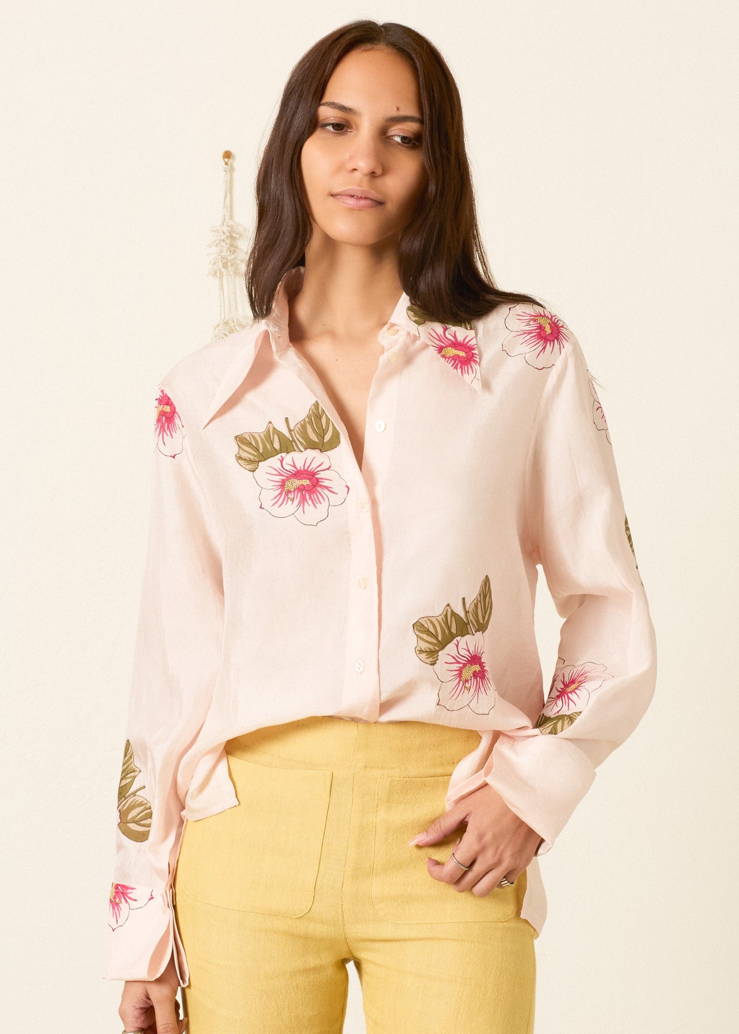 person wearing alix of bohemia womens printed Dana Blush Hibiscus Silk Shirt