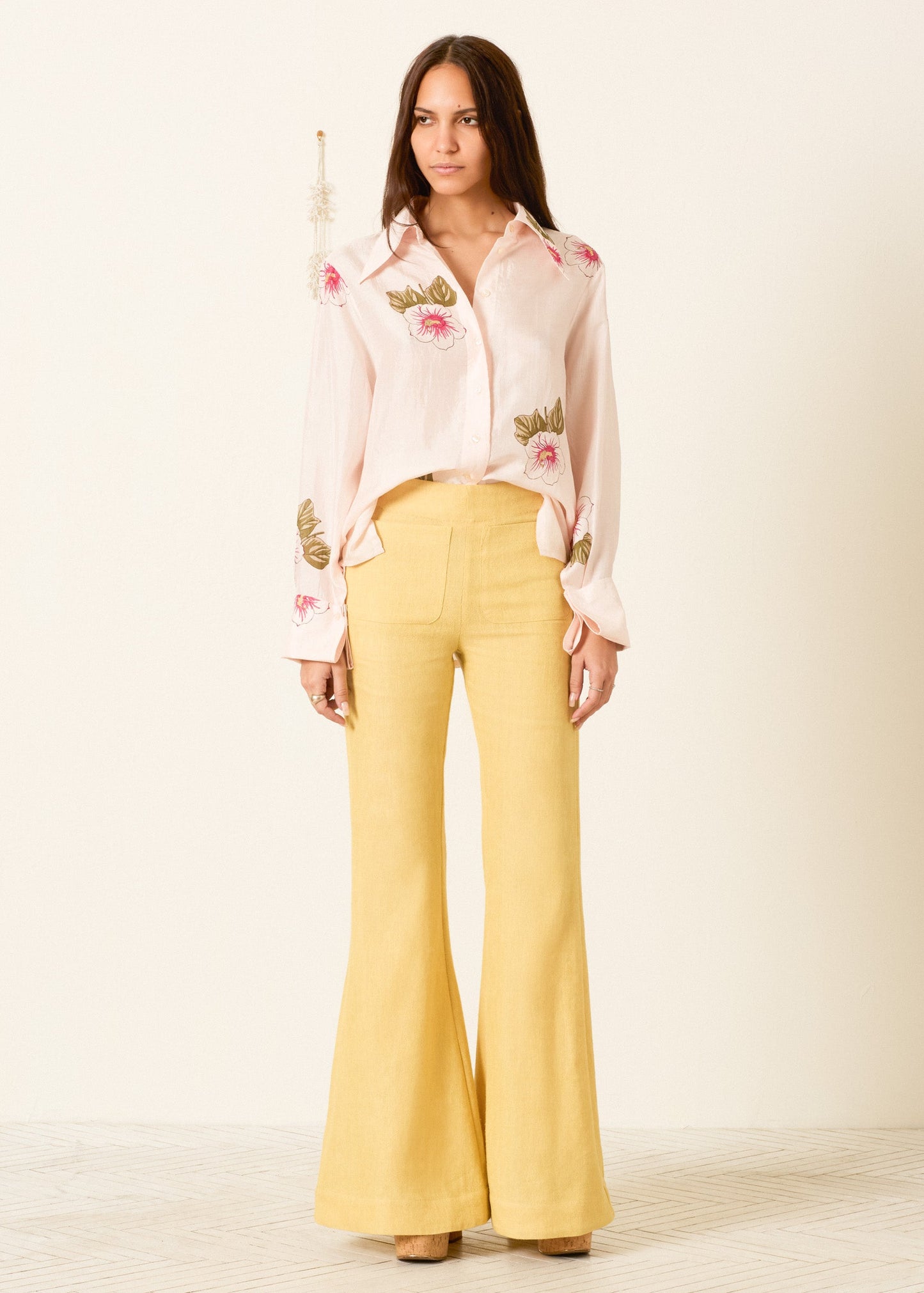 person wearing alix of bohemia womens printed Dana Blush Hibiscus Silk Shirt