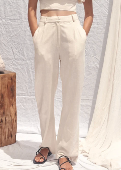 person wearing all that remains womens ivory linen Cairo Pant