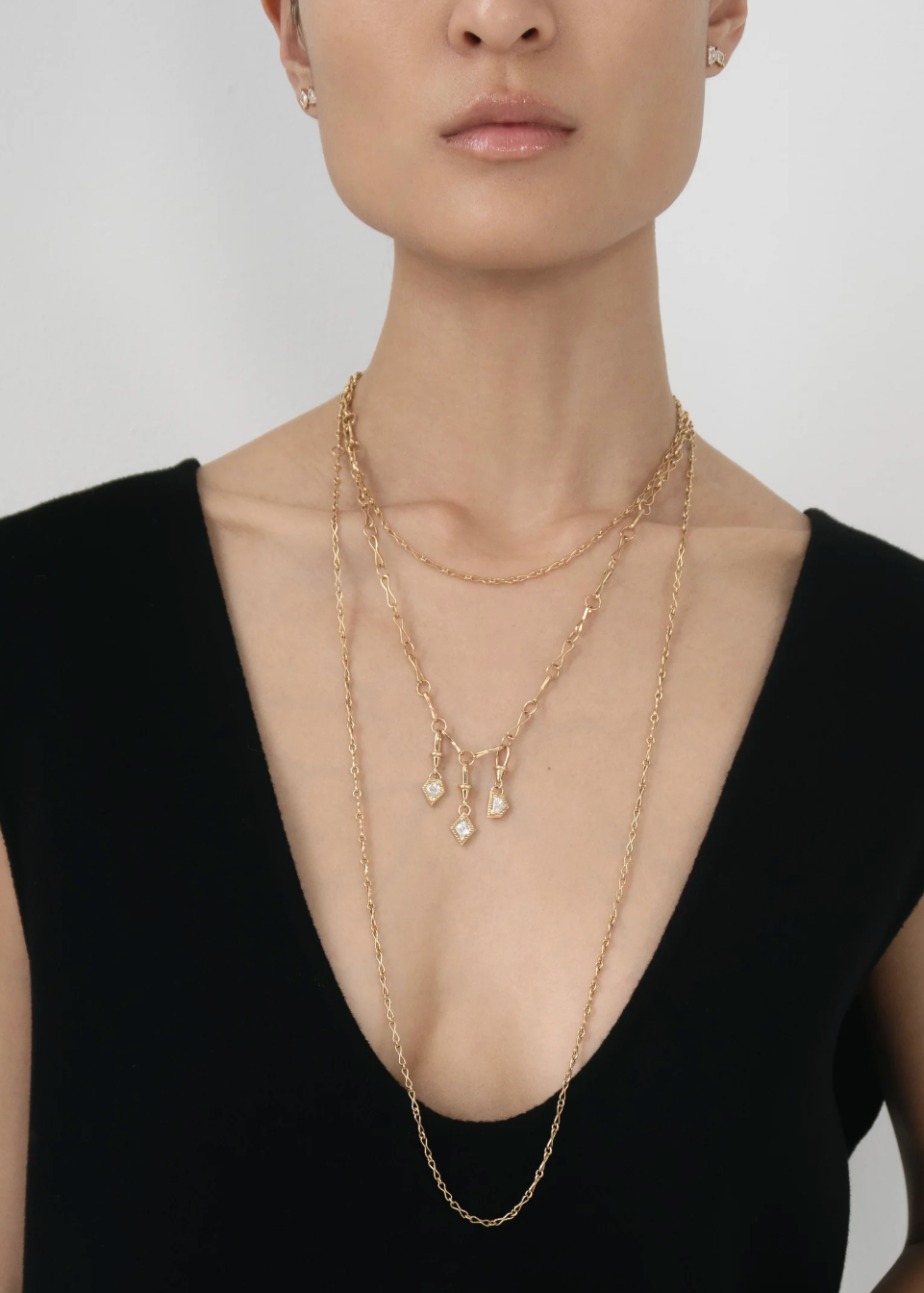 person wearing azlee fine jewelry 18k yellow gold Escalier .50ct Lozenge Diamond Charm necklace
