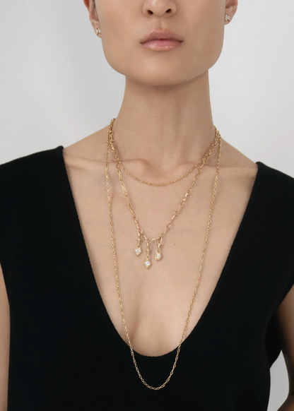 person wearing azlee fine jewelry 18k yellow gold Escalier .50ct Lozenge Diamond Charm necklace