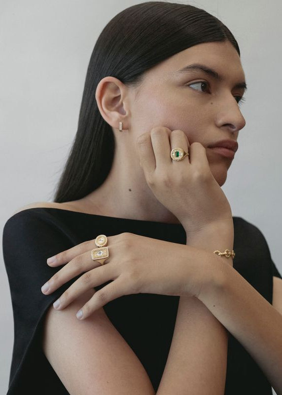 person wearing azlee fine jewelry 18k yellow gold Lozenge Diamond Coin Signet Ring