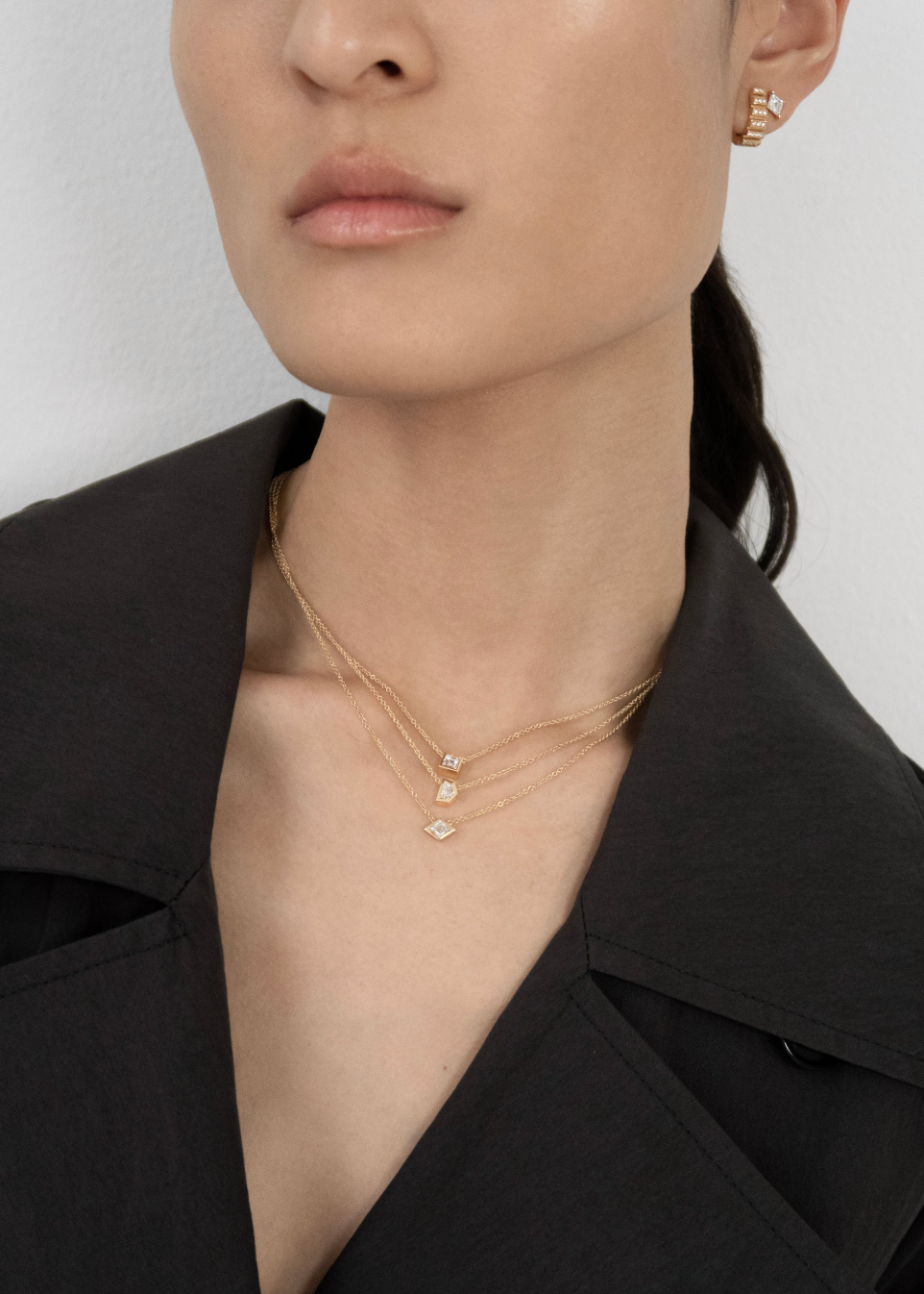 person wearing azlee fine jewelry 18k yellow gold Trace Shield Diamond Necklace trace lozenge diamond necklace