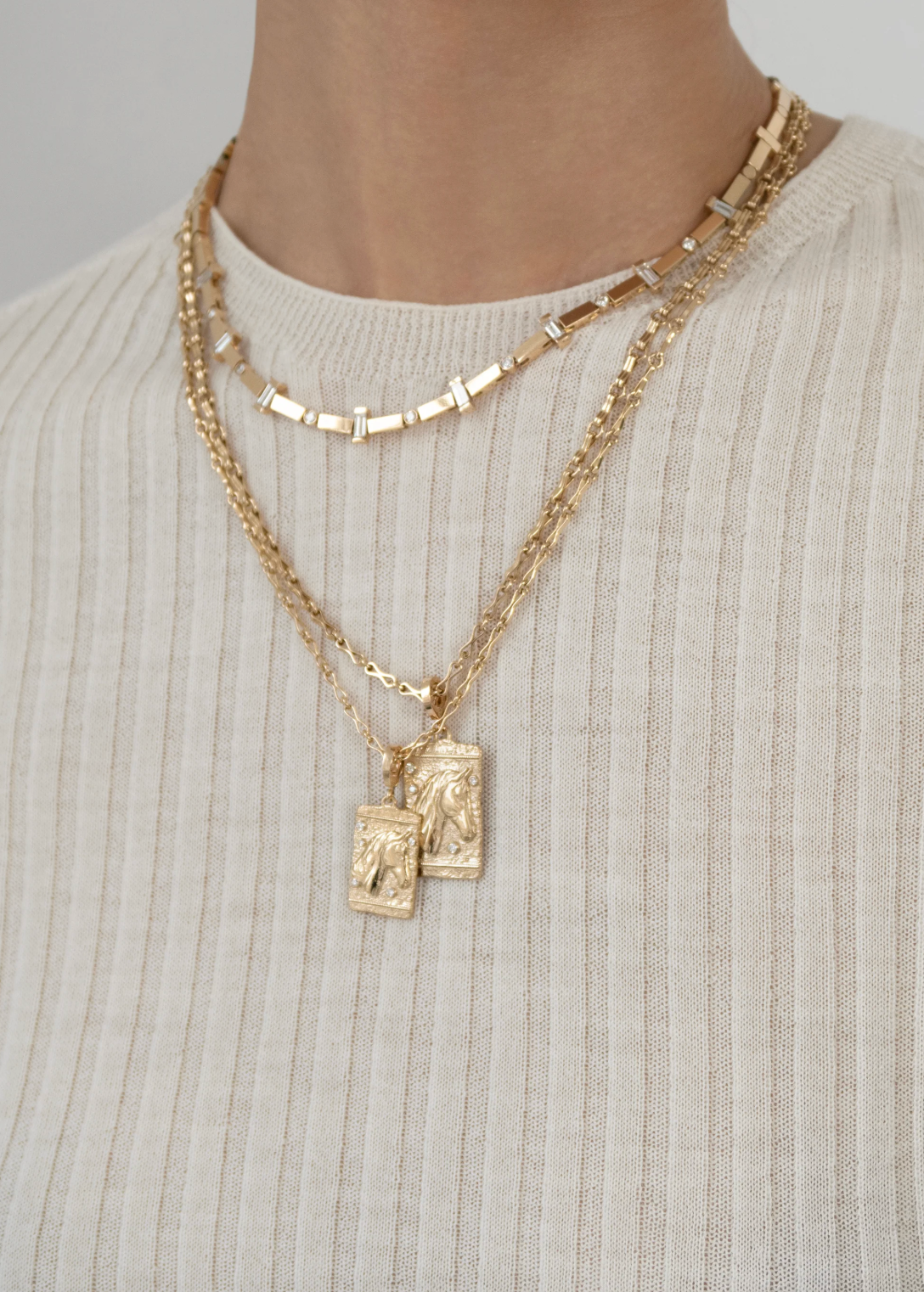 person wearing azlee fine jewelry 18k yellow gold diamonds Horse Medium Relic Coin necklace