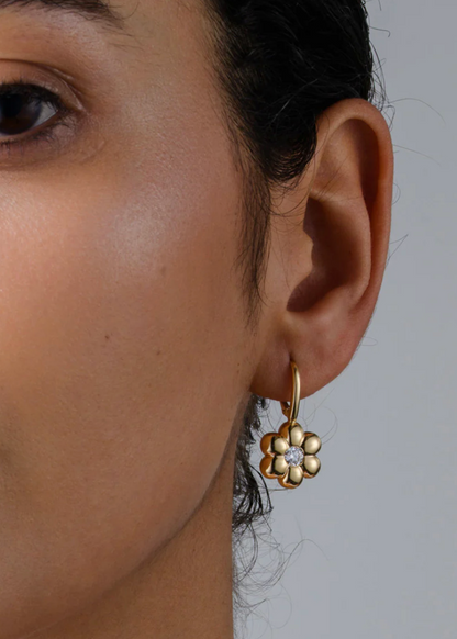 person wearing boochier fine jewelry 18k yellow gold Diamond Flower Puff Clip Hoop Earrings