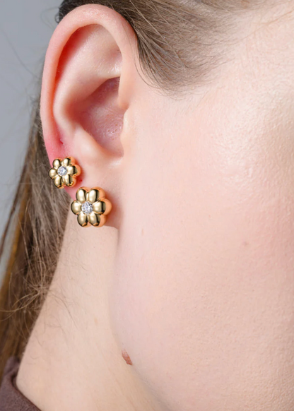 person wearing boochier fine jewelry 18k yellow gold Mini Diamond Flower Puff Studs