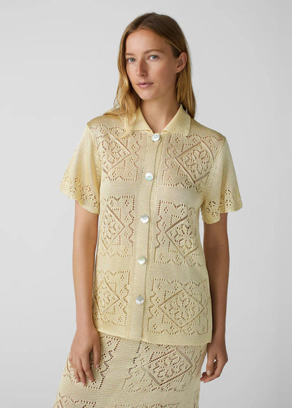 person wearing calle del mar womens viscose Handkerchief Short Sleeve Shirt In Custard yellow
