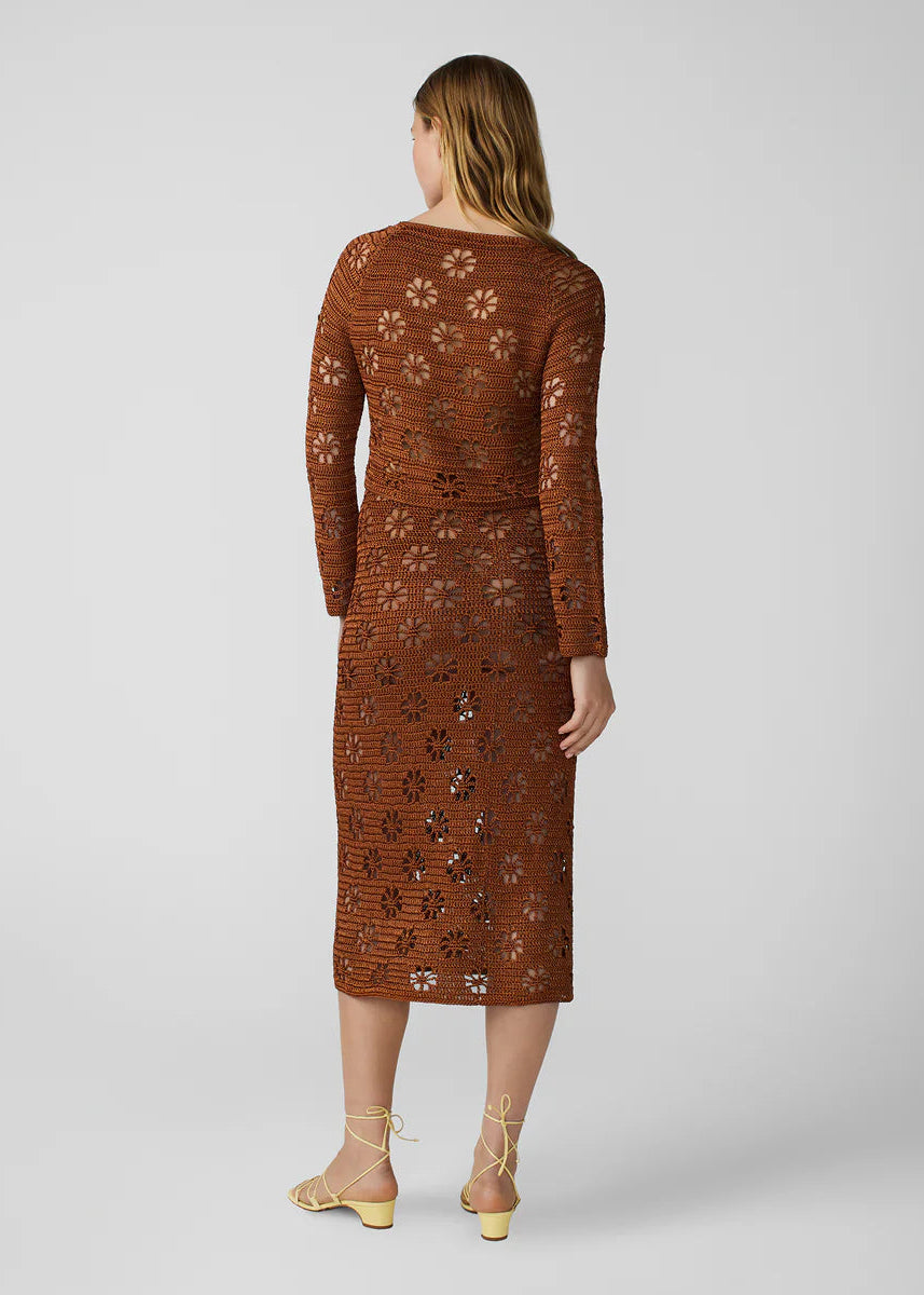 person wearing calle del mar womens viscose knit Floral Crochet Cardigan and skirt set in Suede