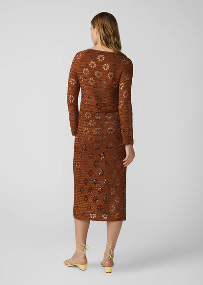 person wearing calle del mar womens viscose knit Floral Crochet Cardigan and skirt set in Suede